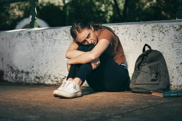 Woman, student and depression in lonely stress, anxiety or mental health problems in the outdoors. .
